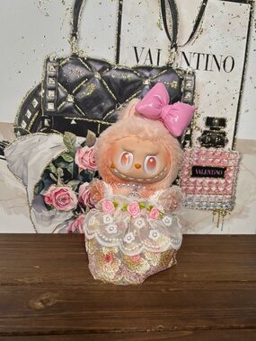 Adorable Labubu with Floral Lace Dress and pink Bow.